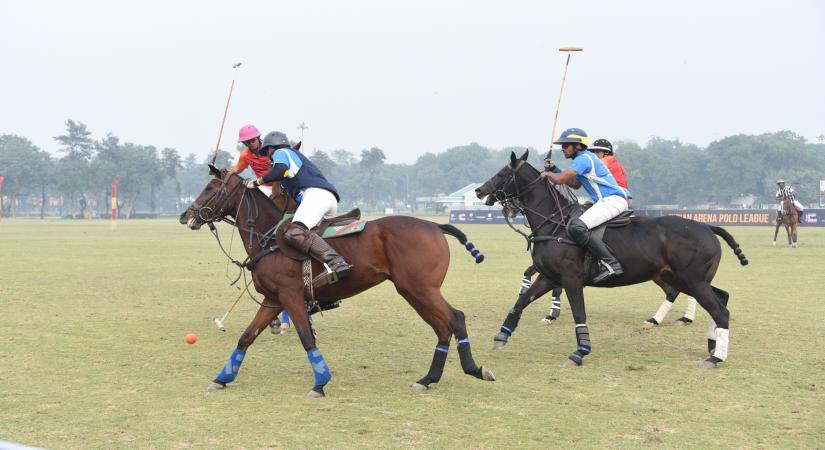 Polo players in action