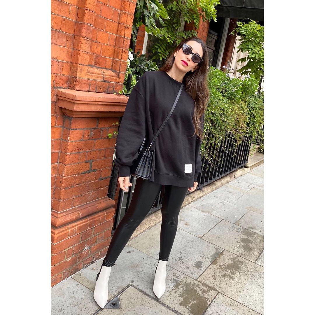  Karsima Kapoor in a pair of leather pants with ankle-high boots.