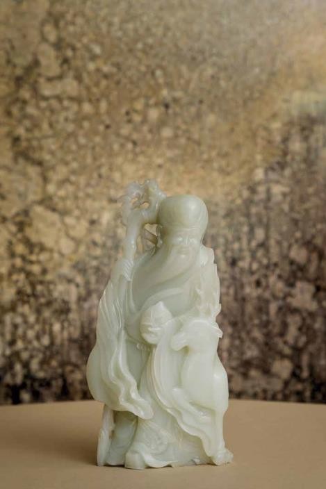AN EXCEPTIONALLY RARE LARGE WHITE JADE CARVING OF SHOULAO AND DEER QIANLONG-JIAQING PERIOD (1736-1820) 10 11/16 in. (27.2 cm.) high Estimate: HK$5,000,000 – 7,000,000