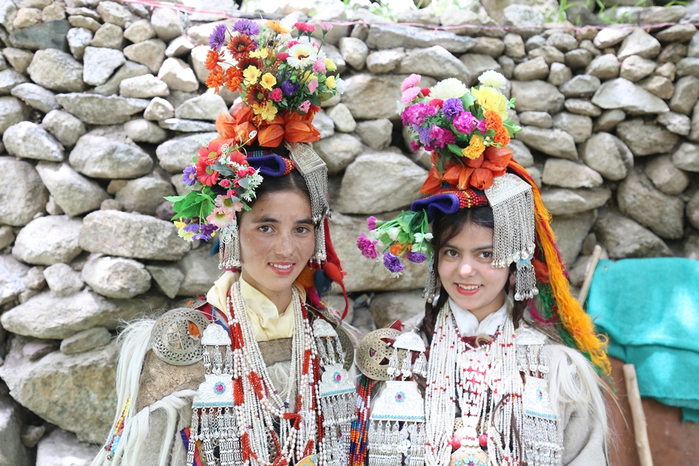 Aryan women from Garkhon village decked in colourful traditional attire