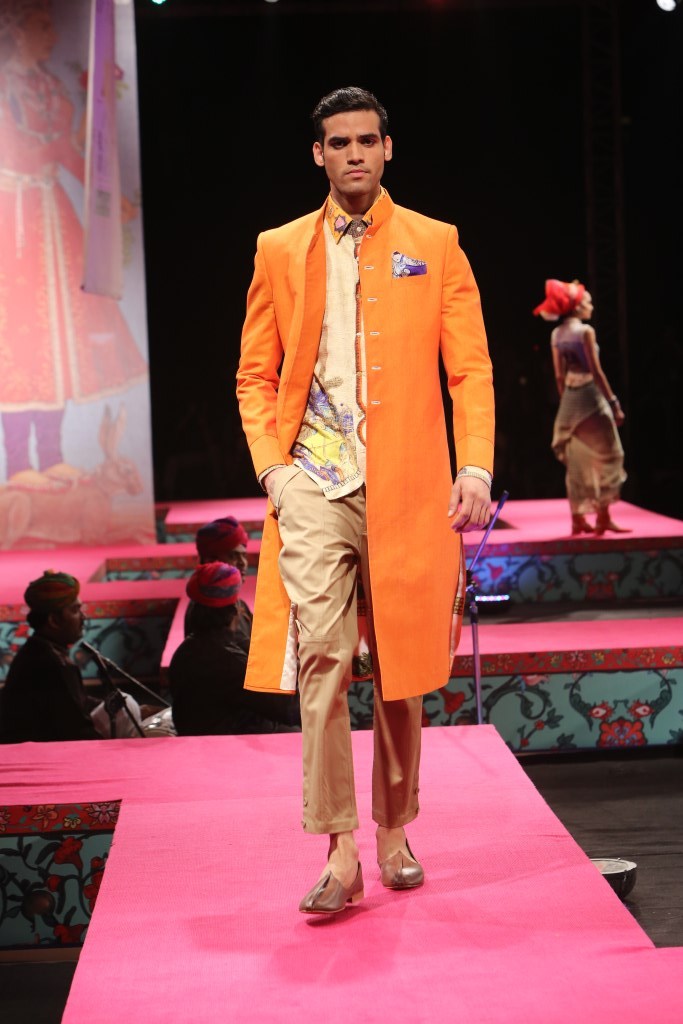 A model walks the ramp showcasing fashion designer Tarun Tahiliani's creation