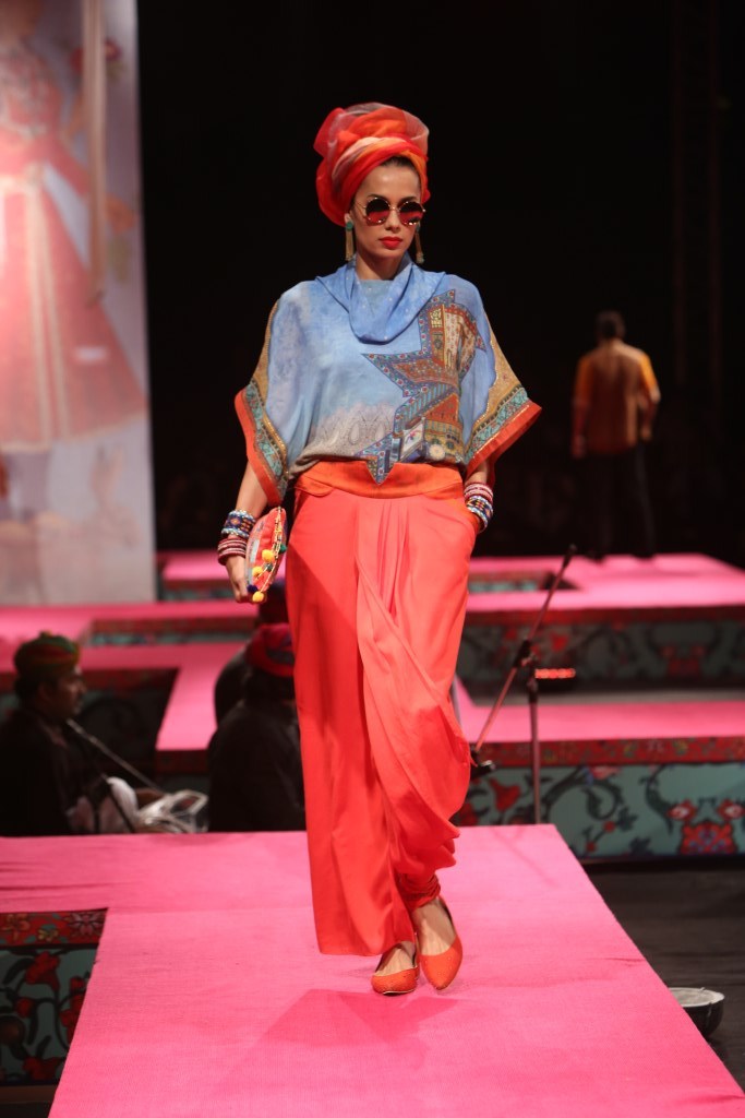 A model walks the ramp showcasing fashion designer Tarun Tahiliani's creation