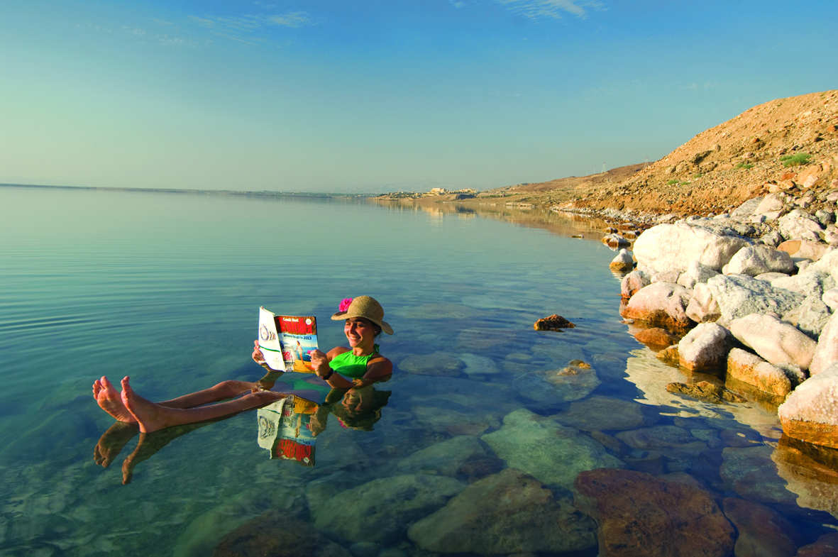 A tourist enjoying in the Dead Sea