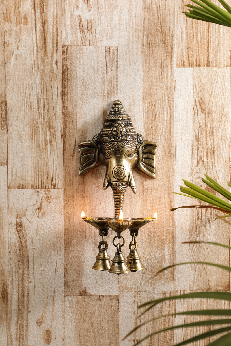 ONVAY Ganesh Diwali Diyas Brass Wall Hanging Oil Lamp with Three Diyas and Bells from Pepperfry Rs. 1999