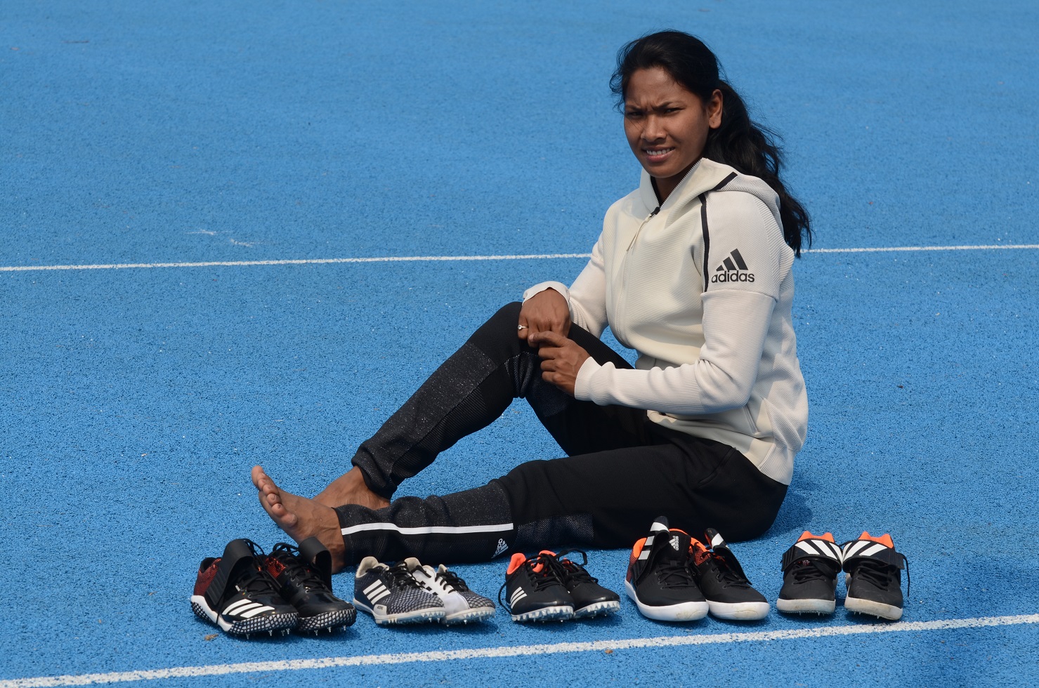 Swapna Burman with her 5 specially customised shoes from adidas