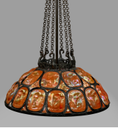 TIFFANY STUDIOS RARE ‘TURTLE-BACK’ CHANDELIER, CIRCA 1910 leaded and plated glass, patinated bronze 15 in. high, 26¾ in. diameter of shade, 41 in. drop $150,000-250,000