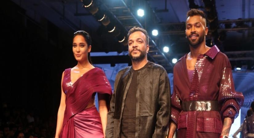 Actress Lisa Haydon and Hardik Pandya showcase creations of fashion designer Amit Aggarwal 
