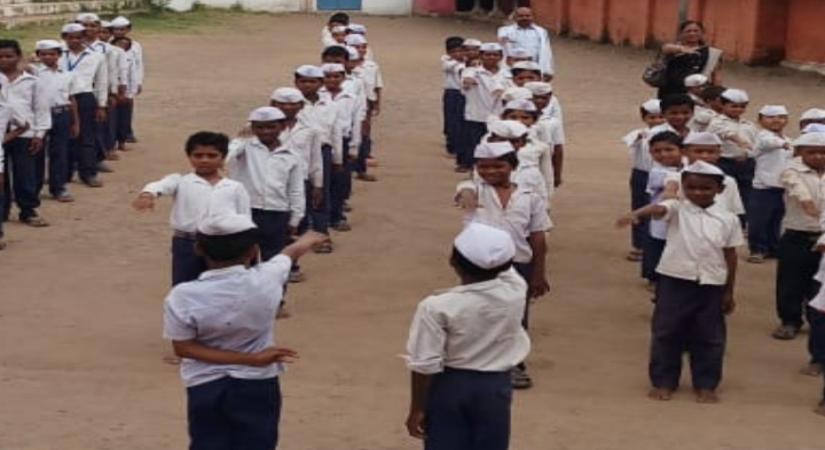 Children wearing Gandhi cap