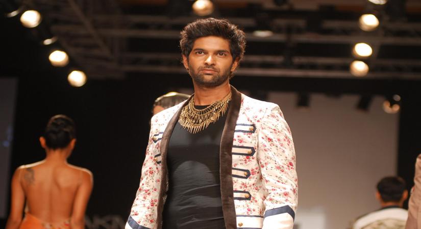 Actor Purab Kohli displays the creations of fashion designer Lalit Sengar during the Lakme Fashion Week (LFW) Summer/ Resort 2014 day 4, in Mumbai on March 14, 2014. (Photo: IANS)