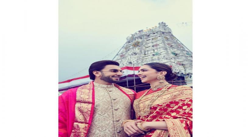Bollywood couple Deepika Padukone and Ranveer Singh started celebrations of their first wedding anniversary on November 14 by visiting Lord Venkateswara temple. While Deepika wore a red saree with gold zari work, Ranveer looks dapper in a bandhgala beige sherwani.