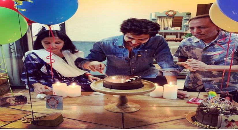 Actor Kartik Aaryan, who is busy shooting "Dostana 2", got a special suprise from his parents on his 29th birthday on Friday. Kartik took to Instagram and shared a few pictures and videos in which he can be seen cutting his birthday cake along with his parents at his residence in Mumbai.