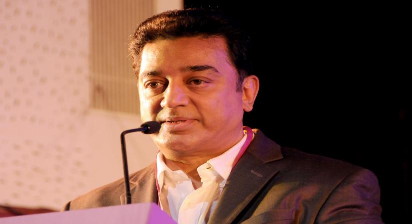 Actor Kamal Hasan addresses during inauguration of Bangalore International Film Festival at Jnana Jyothi Auditorium in Bangalore on Dec.26, 2013. (Photo: IANS)