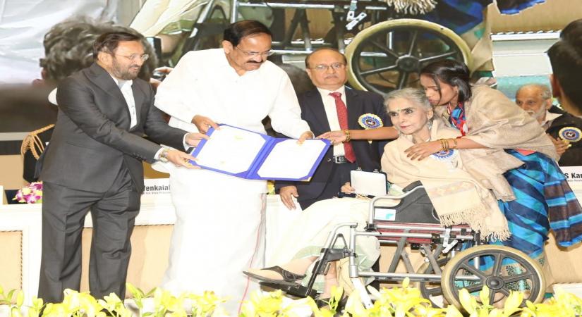 New Delhi: Actress Surekha Sikri receives Best Supporting Actress Award for the film "Badhaai Ho" from Vice President M. Venkaiah Naidu and Union Information and Broadcasting Minister Prakash Javadekar during 66th National Film Awards in New Delhi on Dec 23, 2019. (Photo: Amlan Paliwal/IANS)