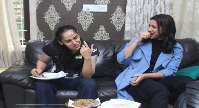 Saina Nehwal treated actress Parineeti Chopra with her mother's special aloo parathas during her visit to visited the ace badminton star's home in Hyderabad. In a string of photographs, Parineetin and Saina are seen gorging on some hot paranthas.