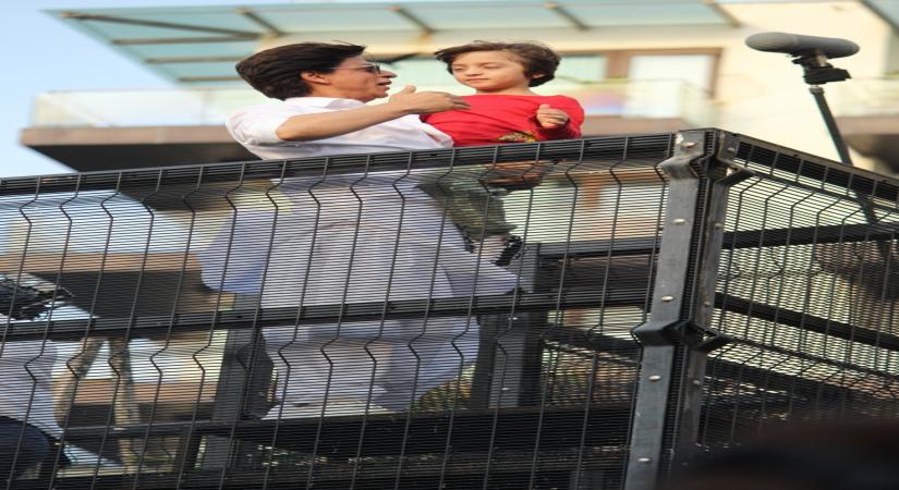 Mumbai: Actor Shahrukh Khan and his son AbRam Khan during a fan meet from the balcony of Mannat on Eid-ul-Fitr celebrations, in Mumbai, on June 5, 2019. (Photo: IANS)