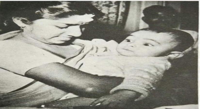 Veteran actor Rishi Kapoor on Tuesday walked down memory lane as he shared a throwback picture in which the legendary singer Lata Mangeshkar is seen cradling him in her arms when he was just an infant.