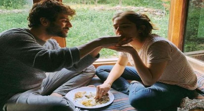 Bollywood actor Kartik Aaryan shared a love-filled photograph of himself along with his "Love Aajkal" co-star Sara Ali Khan. Kartik on Monday took to Instagram, where he shared a photograph of himself feeding Sara.
