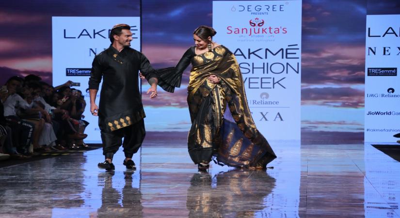Actors Bipasha Basu and Karan Singh Grover walks the ramp on Lakme Fashion Week Day 4, in Mumbai 