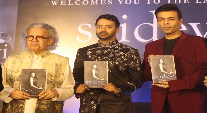 Mumbai: Author Satyarth Nayak along with with filmmaker Karan Johar and other dignitaries, unveils late actress Sridevi's biography "Sridevi: The Eternal Screen Goddess" written by him, in Mumbai on Dec 22, 2019. (Photo: IANS)