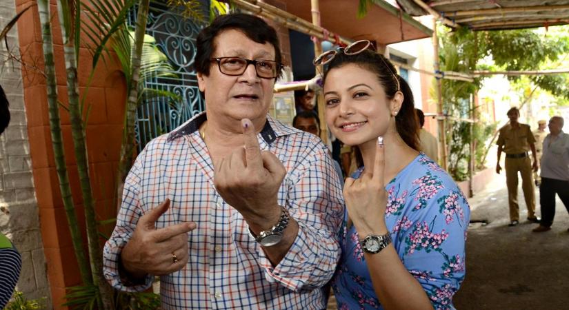 Kolkata: Actor Ranjit Mallick with his daughter-actress Koel Mallick, show their forefinger marked with indelible ink after casting vote during the last phase of 2019 Lok Sabha polls, in Kolkata, on May 19, 2019. (Photo: IANS)