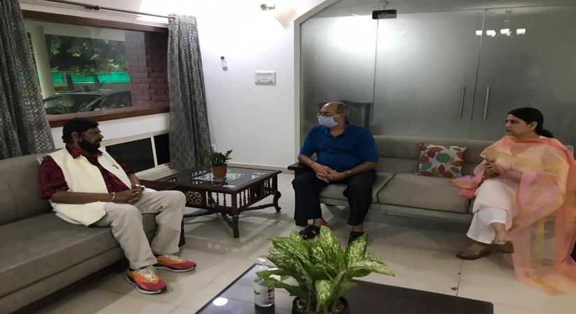 Faridabad: Union Minister and Rajya Sabha member Ramdas Athawale meets late actor Sushant Singh Rajput's father KK Singh at their residence in Faridabad on Aug 28, 2020. (Photo: IANS)