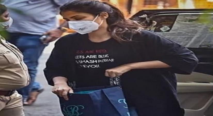 Rhea Chakraborty makes a statement with her T-shirt as she arrives for questioning at the Narcotics Control Bureau. (Source: Instagram)