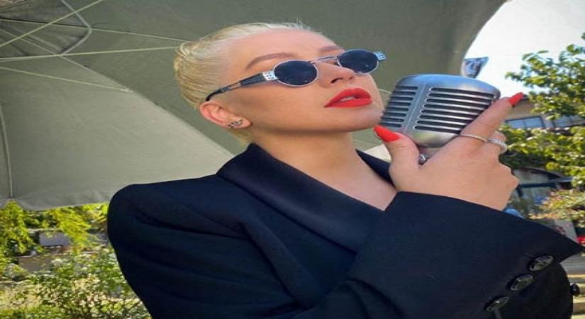 Christina Aguilera didn't find kissing Madonna in 2003 'shocking'.