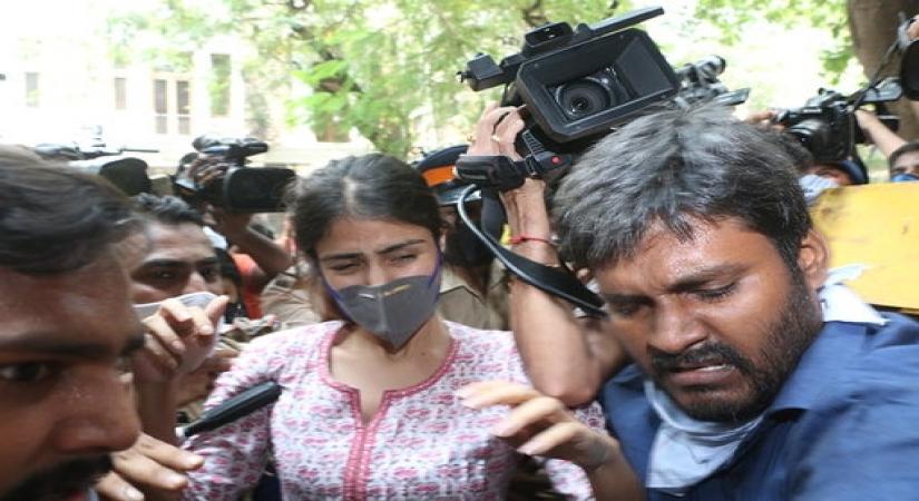 Mumbai: Crying 'witch-hunt' and resigned to the possibility of arrest, Bollywood actress Rhea Chakraborty appeared at the Narcotics Control Bureau office in connection with the probe into the drugs angle clouding the death of actor Sushant Singh Rajput, in Mumbai on Sep 6, 2020. Rhea was mobbed by the media as she tried making her way into the NCB office on Sunday, despite being escorted by police personnel. Several celebrities have called out the media behaviour, terming it as barbaric. (Photo: