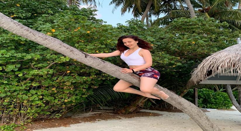 Elli AvrRam turns a flying witch riding the stick on Halloween.