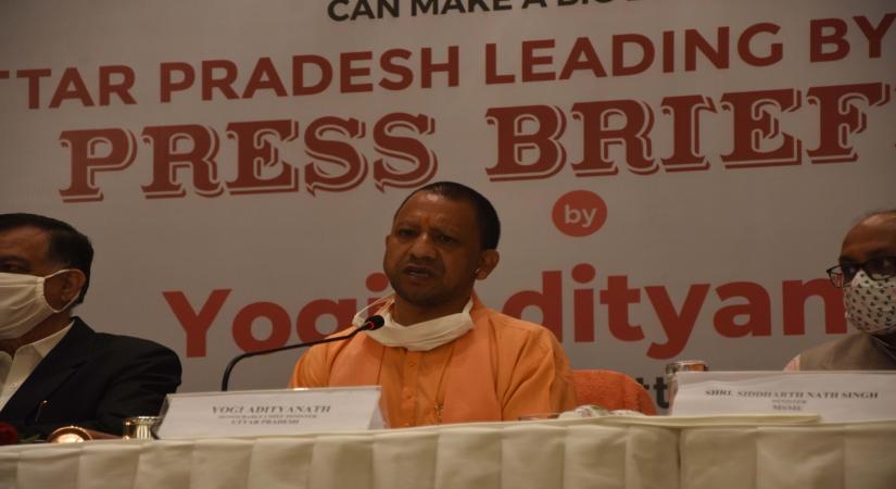 Mumbai: Uttar Pradesh Chief Minister Yogi Adityanath addresses a press briefing in Mumbai on Dec 2, 2020. Yogi Adityanath rang the bell at the Bombay Stock Exchange (BSE) marking the listing of bonds of the Lucknow Municipal Corporation (LMC), here on Wednesday morning. Adityanath attended a special listing function organized at the BSE Towers this morning where he performed the traditional bell ringing ceremony, hoping to herald a new investment start for Uttar Pradesh through the route of Muni