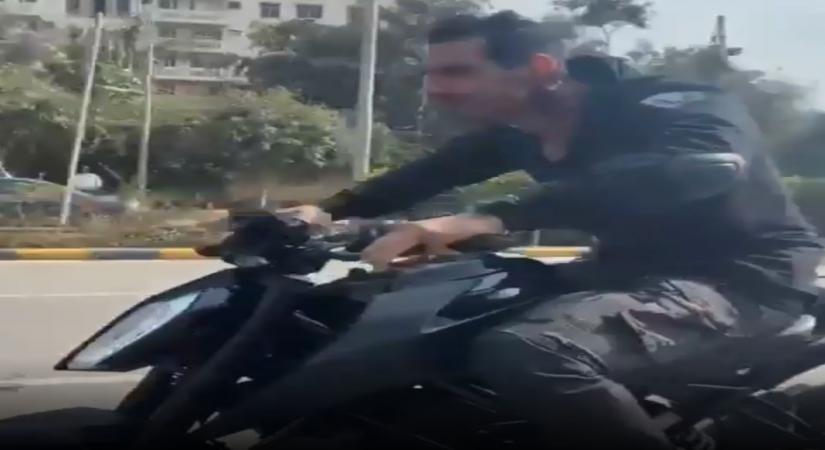 Actor John Abraham took to Instagram on Wednesday shared a sneak peek of a bike stunt of his upcoming film Attack, but was trolled for not wearing a helmet while riding the two-wheeler.