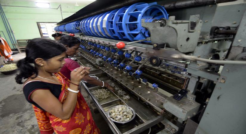 Dharmanagar: Women busy working at a Sericulture unit in Dharmanagar of Tripura on June 10, 2015. (Photo: IANS)
