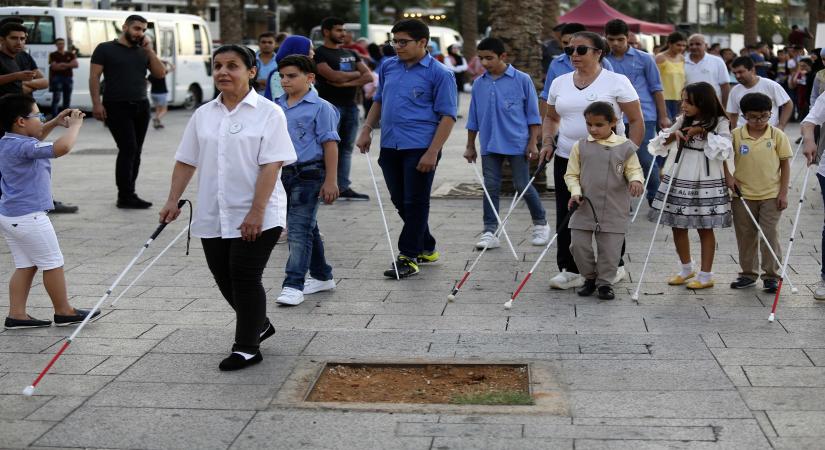 BEIRUT, Oct. 16, 2019 (Xinhua) -- A group of blind people take part in the White Cane Safety Day event held in Beirut, Lebanon, on Oct. 16, 2019. Some welfare institutions in Lebanon organized activities for people with visual handicaps on Wednesday on the occasion of the White Cane Safety Day, which is an international event marked on Oct. 15 every year to help the public better understand blindness and visual handicaps. (Photo by Bilal Jawich/Xinhua/IANS)