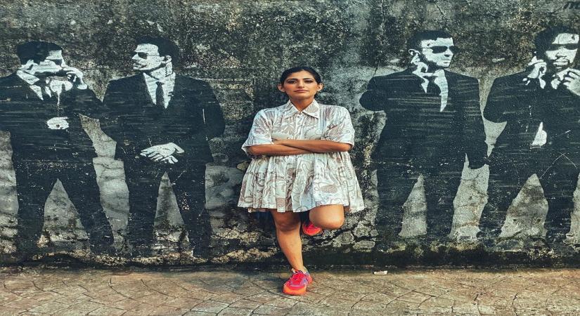 Kubbra Sait shares a cool picture against a wall mural