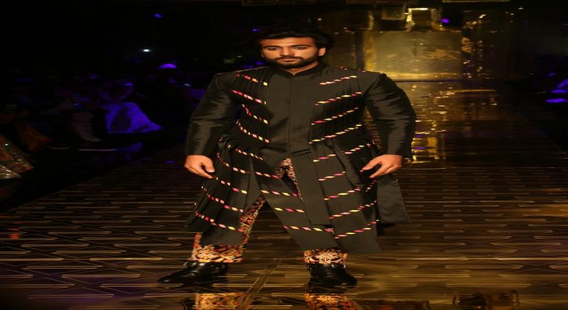 Mumbai: Actor Meezaan Jaffrey showcases a creation of fashion designer Abu Jani-Sandeep Khosla during a fashion show in Mumbai, on Sep 5, 2019. (Photo: IANS)