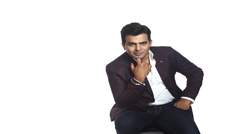 AMIT TANDON.