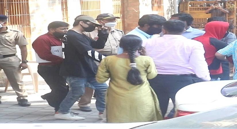 SRK's son Aryan held for consuming, buying, selling drugs.