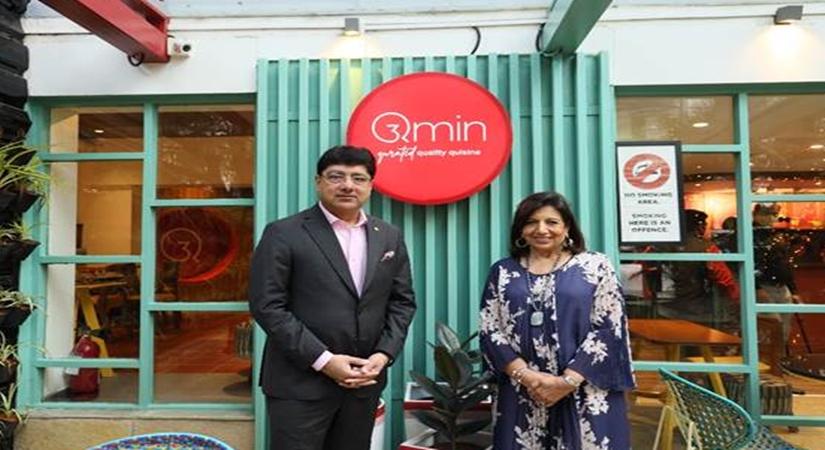 Mr. Puneet Chhatwal, Managing Director and CEO, IHCL and Ms. Kiran Mazumdar Shaw, Executive Chairperson & Founder Biocon Biologics raising a toast at Qmin outlet in the garden city