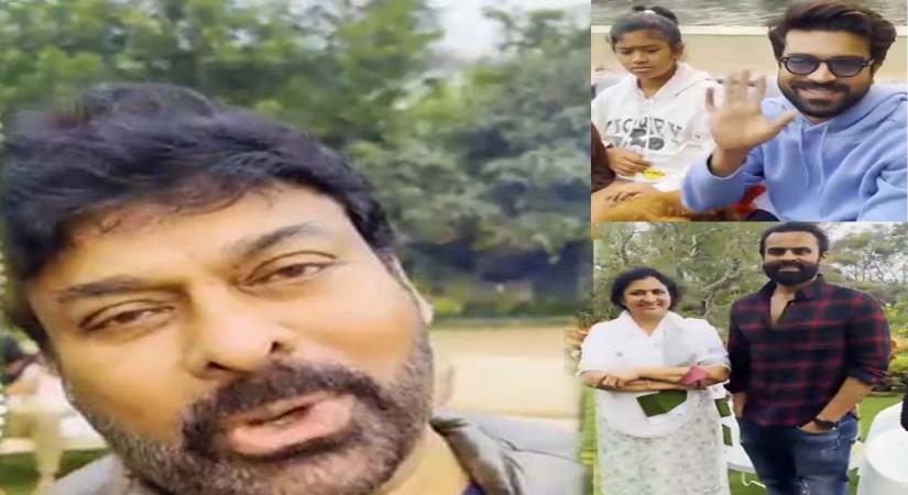Chiranjeevi and Ram Charan seated, wearing dark glasses.