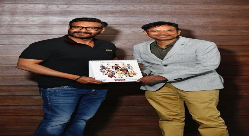 cartoonist Manoj Sinha and Ajay Devgn.