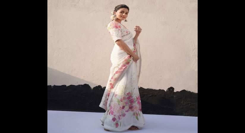 Alia Bhatt in a floral number from Anavila. She styled her sari with chunky silver earrings and natural flowers. Photo: Instagram