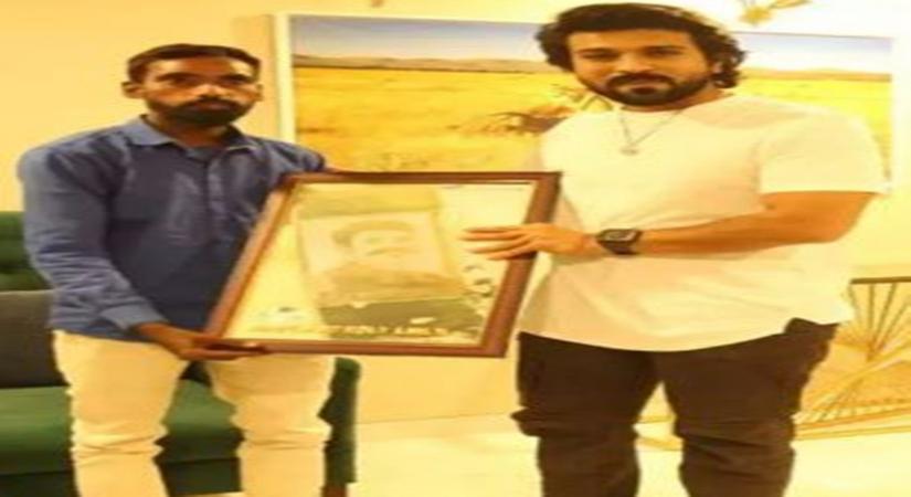 Ram Charan with his fan.