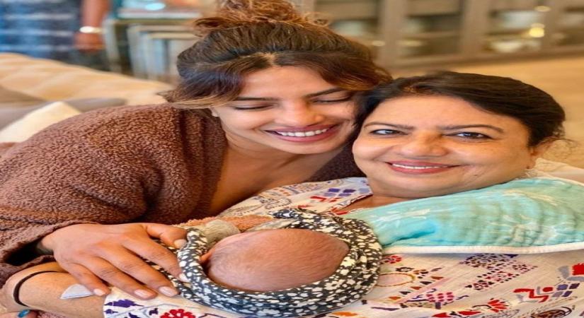 Priyanka shares glimpse of daughter Malti cradled in mother Madhu's arms.(photo:instagram)