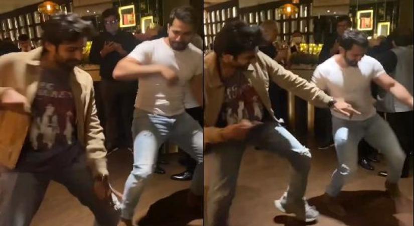 Varun and Kartik dance.