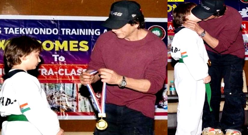 SRK kisses AbRam, honours him with gold medal for winning Taekwondo tournament.(photo:Twitter)