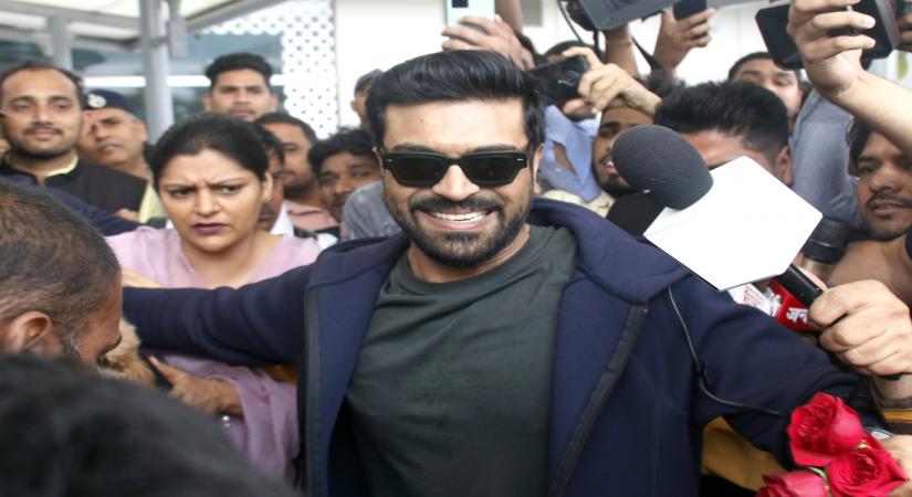 New Delhi: RRR star Ram Charan being welcomed on his arrival at Delhi International Airport after winning Oscar for 'Naatu Naatu', in New Delhi on Friday, March 17,2023. (Photo: Wasim Sarvar/IANS)