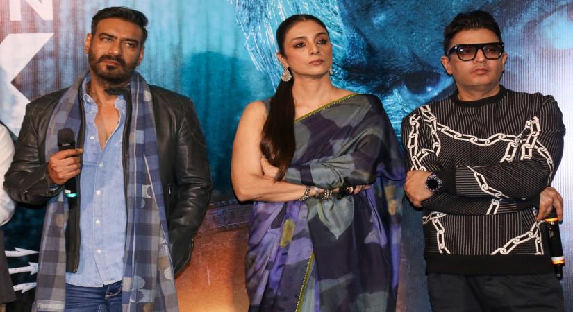 Mumbai :Actors Ajay Devgn, Tabu and Managing Director of T-Series Bhushan Kumar during the trailer launch of his upcoming film 'Bholaa' in Mumbai on Monday, March 06, 2023. (Photo:Sanjay Tiwari/IANS)