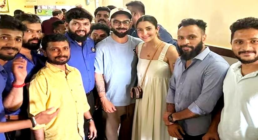 Anushka, Virat pose for a picture with Bengaluru restaurant staff.(photo:Instagram)