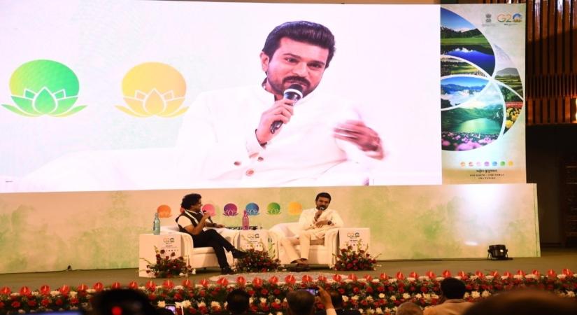 Srinagar: Actor Ram Charan speaks at an event 'Film Tourism for Economic Growth and Cultural Preservation' on the sidelines of the 3rd G20 Tourism Working Group meeting, in Srinagar, on Monday, May 22, 2023.  (Photo:IANS/Twitter)