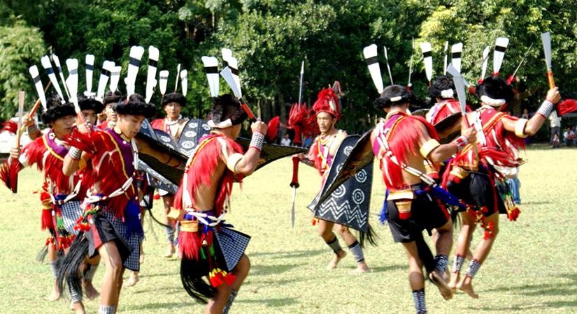 Naga artists perform traditional war dance during the Garo tribe's famous 100 Drums Wangala Festival in the outskirts of Tura in Meghalaya on Nov 6, 2014. (Photo Courtesy: IANS)